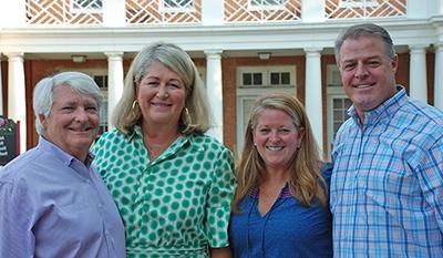 Four Washington College parents in front of Casey Academic Center